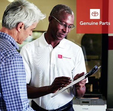 Toyota advisor helping customer | Bommarito Toyota in Hazelwood MO